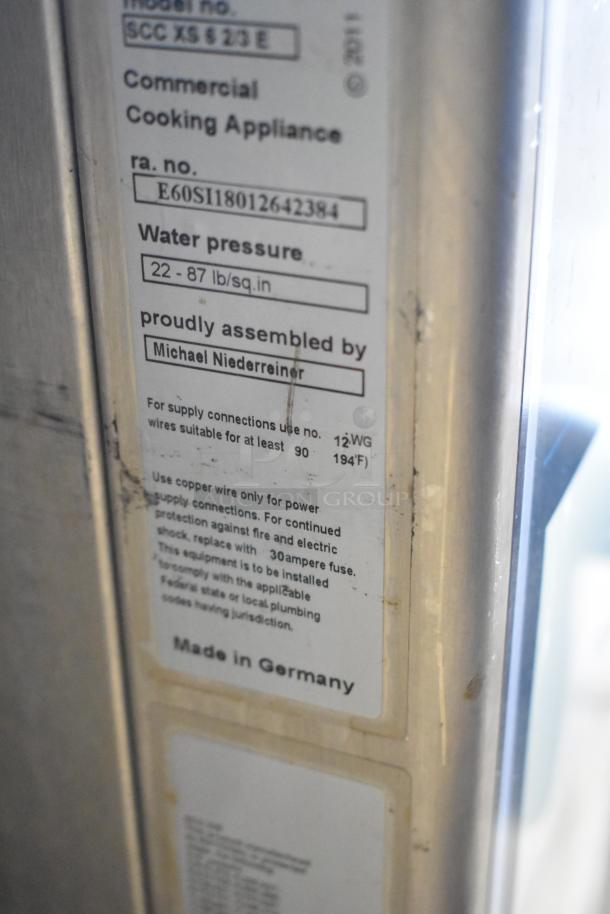 Label of 2018 Rational SCCXS62/3E Steam Oven; commercial appliance info, assembly details, water pressure, and wiring specs.
