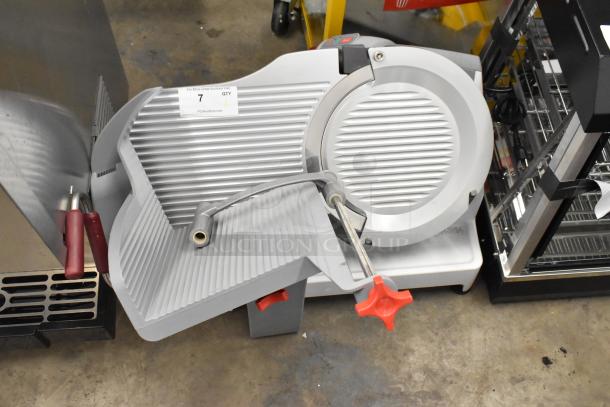 Berkel X13-PLUS metal automatic meat slicer, new scratch and dent, with blade sharpener, 120V, 1-phase, on countertop.