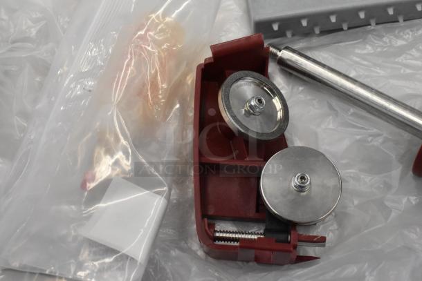 Berkel X13-PLUS meat slicer blade sharpener accessory, red casing, with parts in bag. New, scratch and dent condition.
