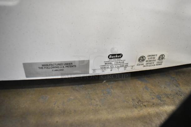 Berkel X13-PLUS meat slicer label showing model, serial number, voltage, and conformity details. New, scratch and dent condition.