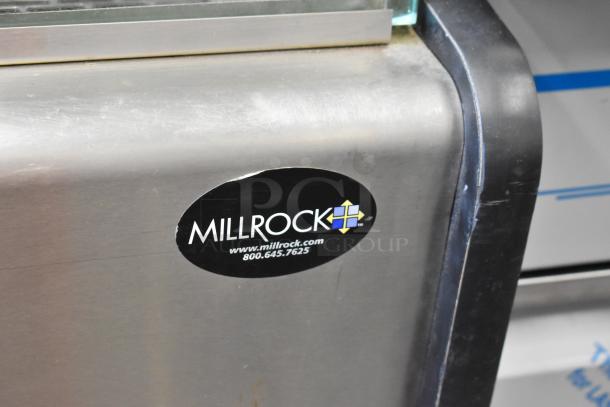 Millrock WC 4881 Merchandiser, metal, commercial open design, includes metal shelves, visible logo with contact info.