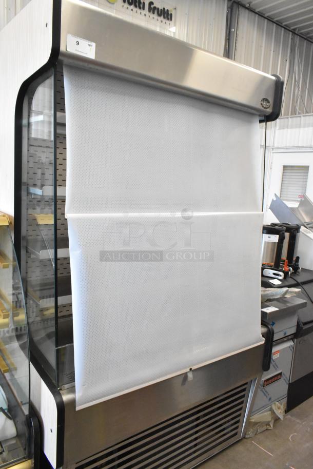 Millrock WC 4881 metal commercial merchandiser with metal shelves, 208-230V, 1 phase, stainless steel finish, covered display.