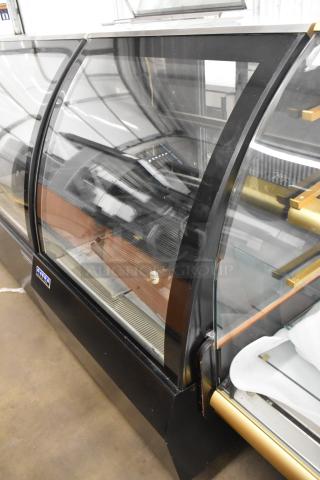 Ojeda RDCH-3 metal deli display case, commercial floor style, 120V, 1 phase, curved glass, visible brand tag.