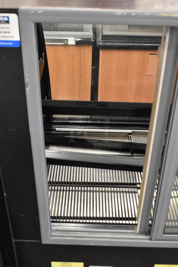Ojeda RDCH-3 deli display case, metal, commercial floor style, 120V, 1 phase, excellent condition, visible shelves and label.