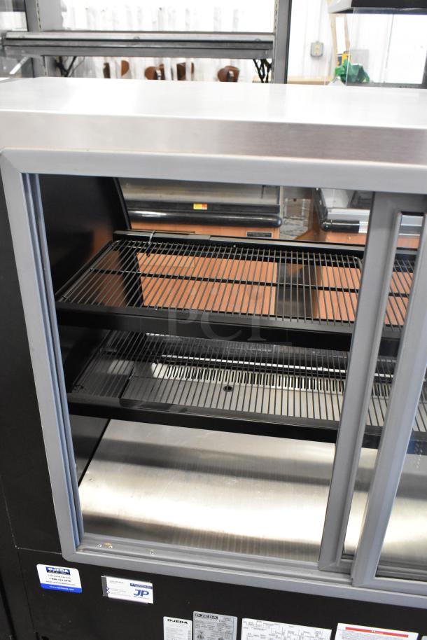 Ojeda RDCH-4 metal deli display case, commercial floor style, shelves visible, labeled 120V, 1 phase.
