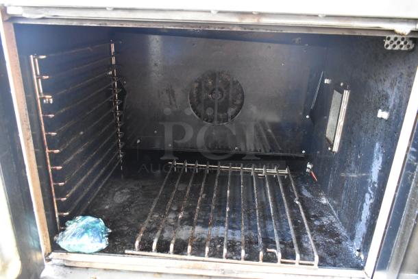 2022 Southbend BGS/13SC convection oven interior, showing racks, fan, and stainless steel walls. Used condition.