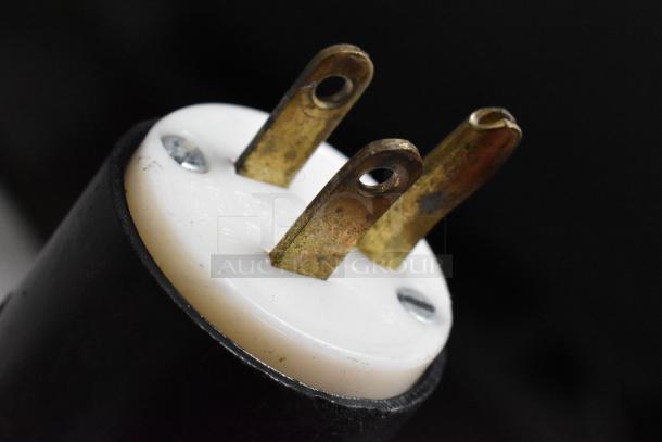 Close-up of an electrical plug for the Knox Metal Commercial Floor Style Open Grab N Go Horizontal Merchandiser.