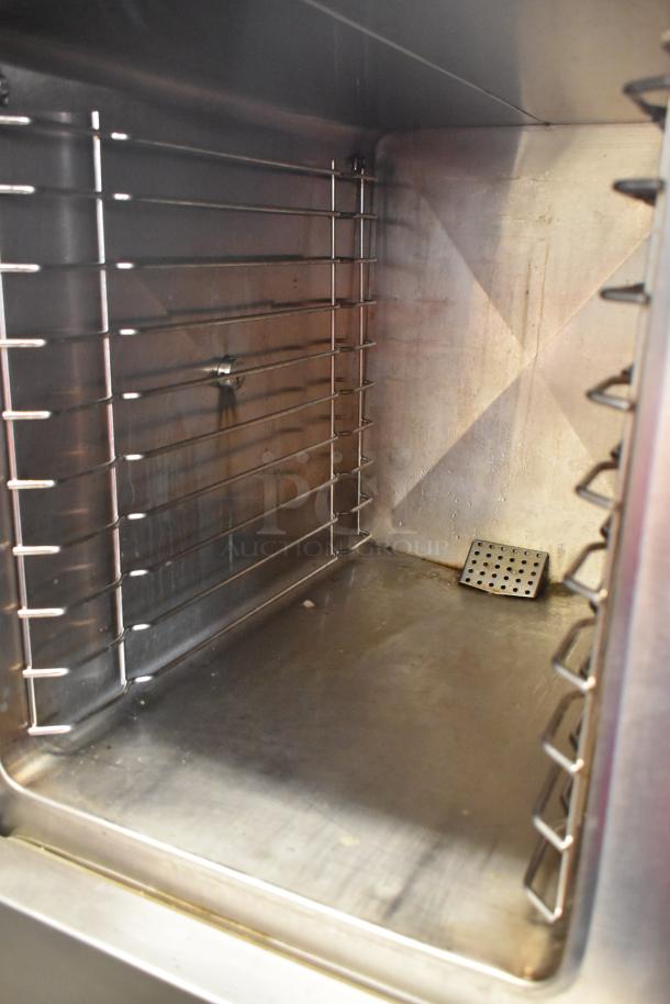 Market Forge ETP-10G stainless steel 2 deck steam cabinet interior, showing clean racks and smooth surfaces.