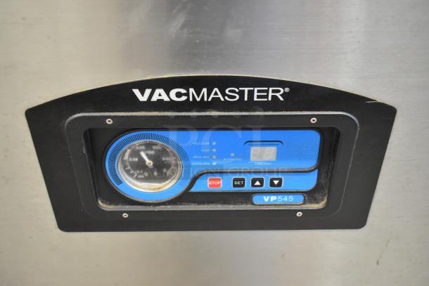 VacMaster VP545 stainless steel commercial vacuum sealer control panel, showing dials and digital display. Model VP545.