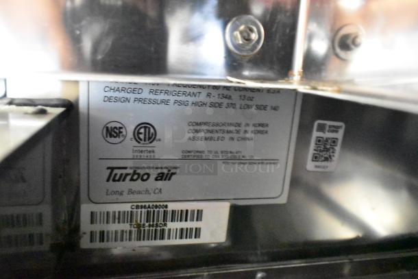 Turbo Air stainless steel 4-drawer chef base with commercial casters. Model info and certifications visible on label.