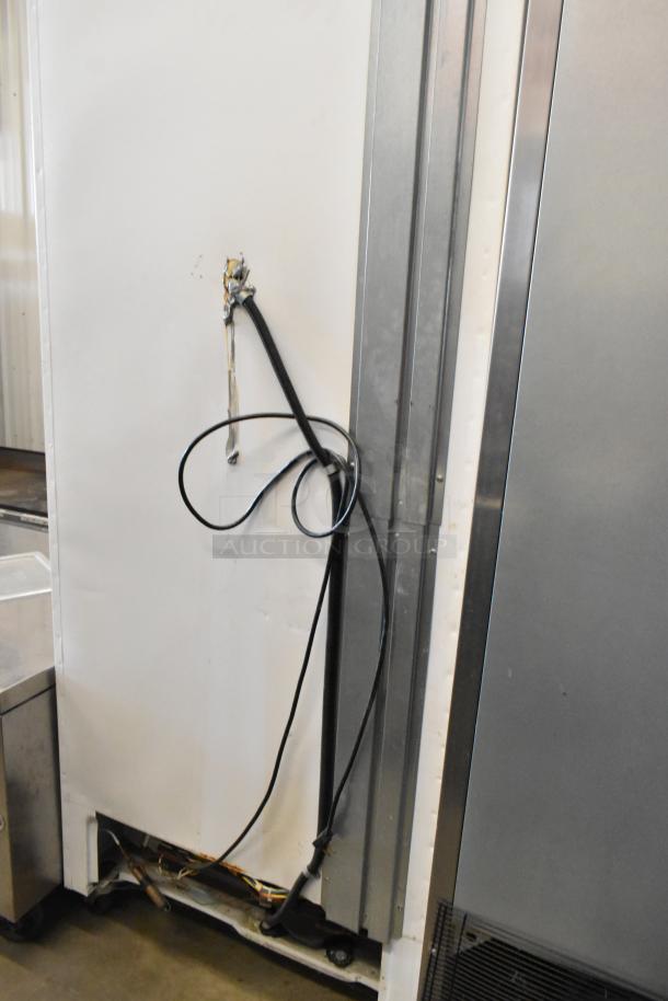 Arctic Air metal commercial single door freezer on casters, 115 volts, 1 phase, visible worn cord, and minor exterior wear.