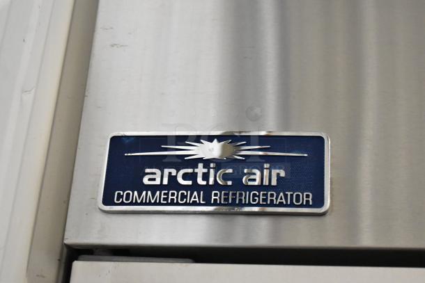 Arctic Air AR49EZ stainless steel 2-door commercial cooler with poly-coated racks and casters. Model label visible.