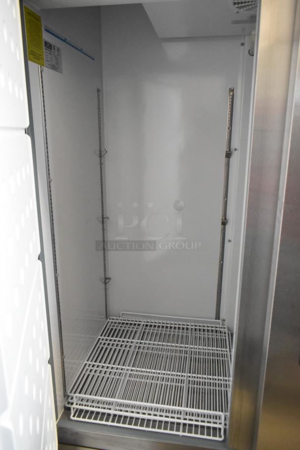 Arctic Air AR49EZ stainless steel 2-door commercial cooler, poly coated racks, on casters, 115 volts, mint condition.