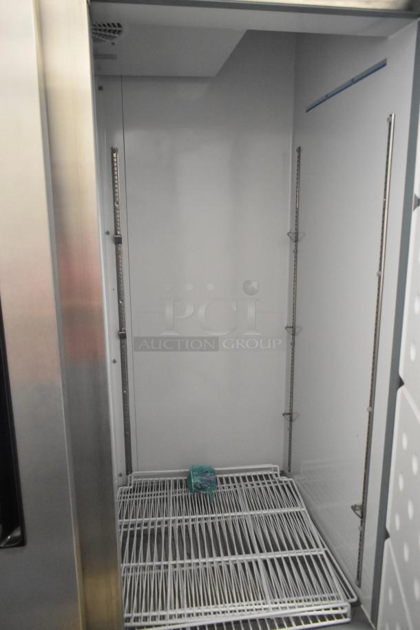 Arctic Air AR49EZ stainless steel 2-door cooler, includes poly-coated racks, commercial casters, 115V, 1 phase.