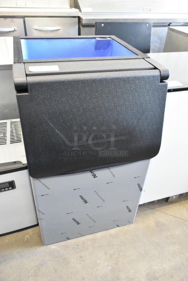 Brand new metal commercial ice bin with minor scratches and dents. Black lid, blue interior. Protective film with "Nito" text visible.
