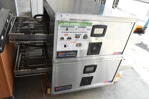2 Middleby Marshall DZ33T stainless steel commercial conveyor pizza ovens on casters. 208V, 3/1 phase.