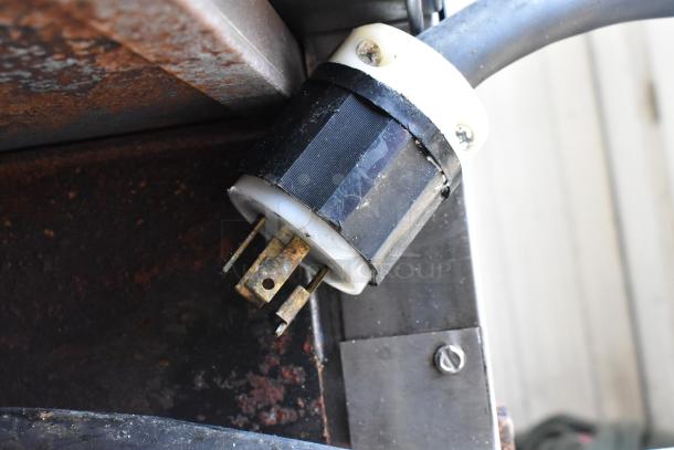 Close-up of plug for Middleby Marshall DZ33T commercial electric pizza oven, showing wear and rust.