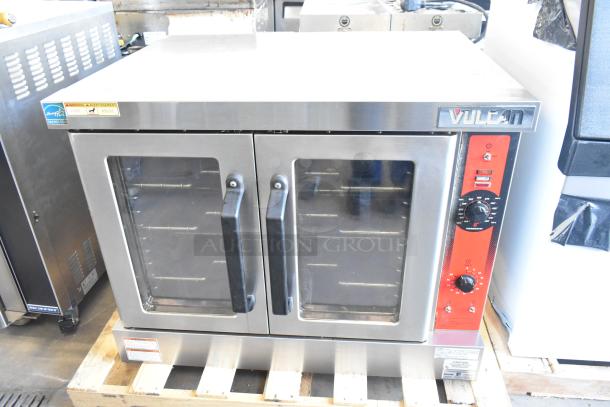 Vulcan VC4GD-21D150K stainless steel convection oven with view-through doors, metal racks, and thermostatic controls.
