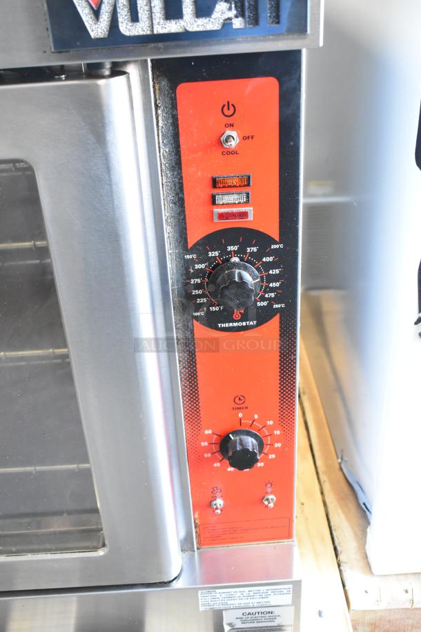 Vulcan VC4GD-21D150K stainless steel convection oven with view-through doors, metal racks, and thermostatic controls.