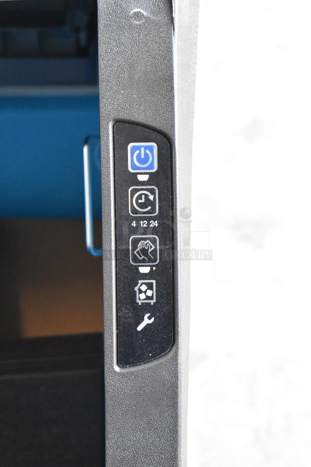 BRAND NEW scratch and dent Manitowoc UYF0190A-161B ice machine control panel with power, timer, and maintenance icons visible.