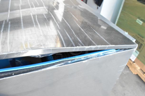 Stainless steel Manitowoc UYF0190A-161B ice machine showing slight dent on edge, 2024 model, 90 lb. capacity, brand new.