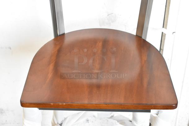28 brand new KoolMore DC-2C bar height chairs, black metal, wooden back and seat, scratch and dent condition.