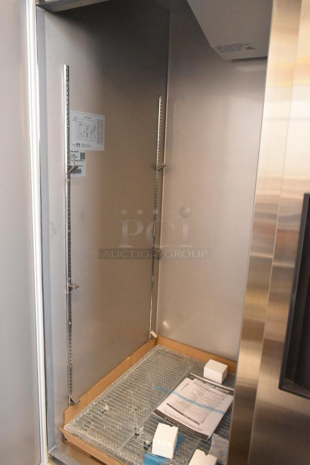 Brand new KoolMore RIR-2D-SS stainless steel 2-door cooler, scratch and dent, with poly-coated racks and manual inside.