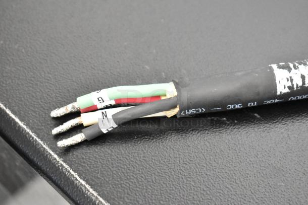 Close-up of wiring of a Bunn ICB TWIN coffee brewer, showing labeled power connections, used for commercial coffee equipment.