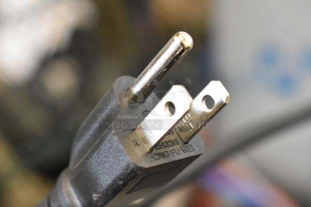 Close-up of a power plug for the 2025 Estella 348EDS18S Dough Sheeter, showing prongs and labeling.