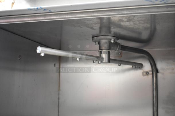 BRAND NEW 2025 Noble Wareforce UL-30 stainless steel undercounter dishwasher interior view, with visible spray arm.