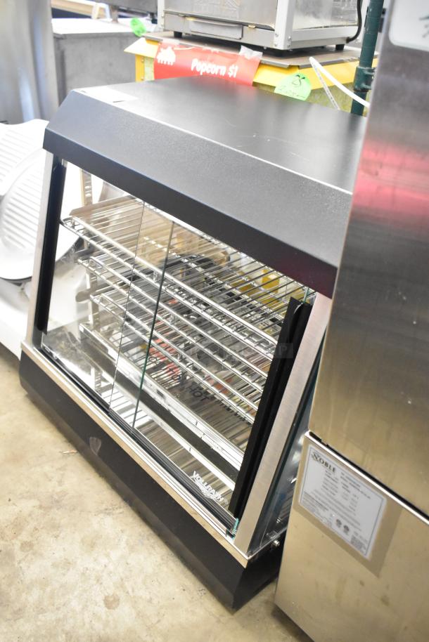 Brand new Vollrath FMA7026 26" hot food merchandiser, scratch and dent condition, 120V, 1 phase, visible shelving.