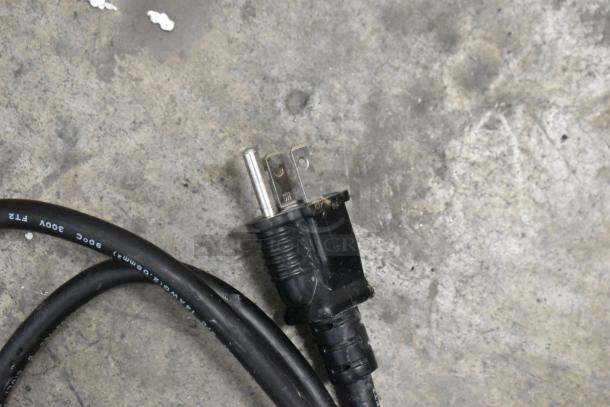 Black power cord with a standard three-prong plug, suitable for the Gaggia CGG191D50NU espresso machine. 300V markings visible.