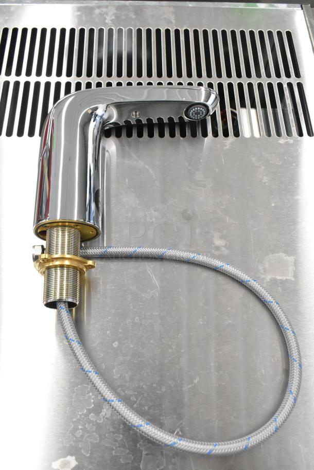 Brand new American Standard 7755105.002 touchless lavatory faucet, 0.5 GPM, deck-mount, minor scratches visible.