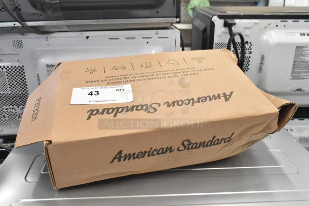 Brand new American Standard 7755105.002 touchless faucet in box, minor box damage, model info on label; battery-operated, 0.5 GPM.