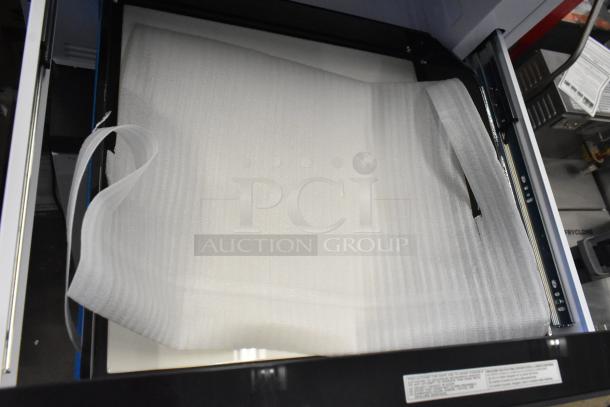 BRAND NEW Scratch and Dent KoolMore KM-MD-1SS 24" Stainless-Steel Microwave Drawer, shown open with protective wrapping.