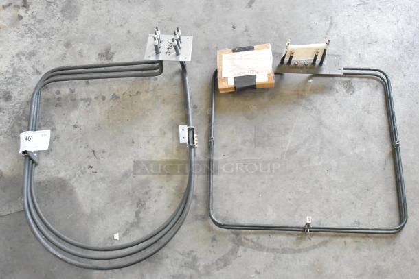 Two brand new Blodgett 8595 Element Assy 240v 5000w units with burners, shown with original packaging and tags.