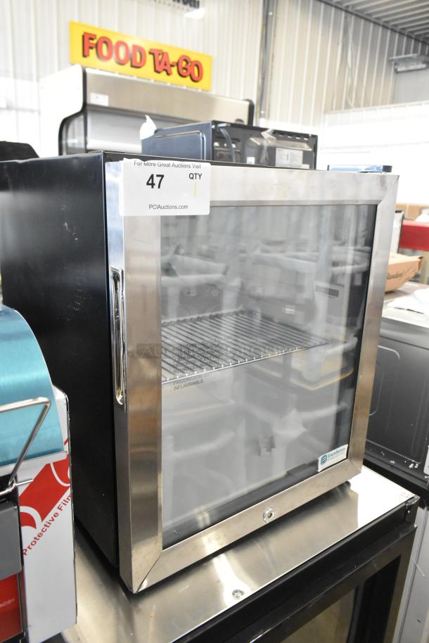 BRAND NEW SCRATCH AND DENT! Excellence EMM-2HC black countertop display refrigerator with swing door, 1.8 cu. ft., minor dents.