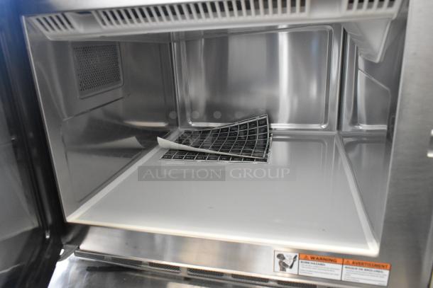 Brand new 2025 Solwave SWA21T commercial microwave interior, stainless steel, with push button controls, slight surface scratch.