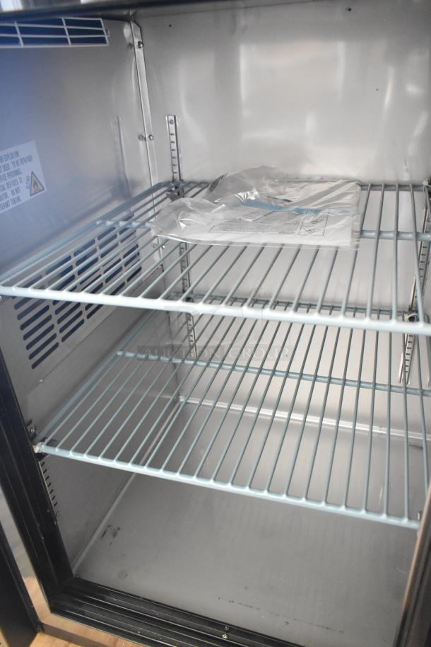 BRAND NEW Avantco 178UBB72SGT back bar refrigerator, sliding glass door, galvanized top, LED lighting, interior view.