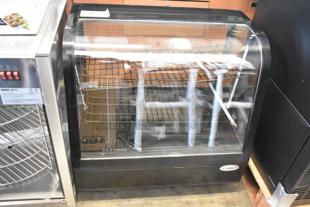 Brand new KoolMore CDC-3C-BK 26" refrigerated display case with adjustable shelves. Scratch and dent condition. 120 volts, 1 phase.