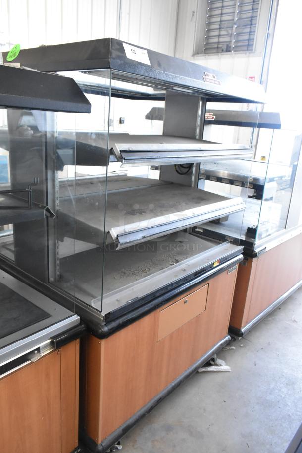 Custom Deli's Inc metal 2-tier warming display case on casters, commercial use, 120-208V, 1 phase. Medium wear visible.
