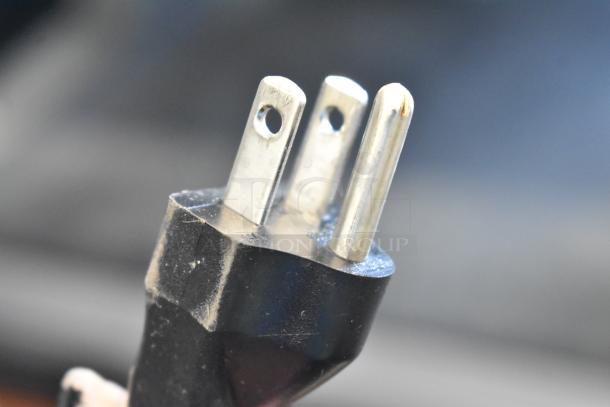 Close-up of 2023 Bunn VPR Coffee Machine plug. Shows three-prong configuration for 120 volts, 1 phase power.