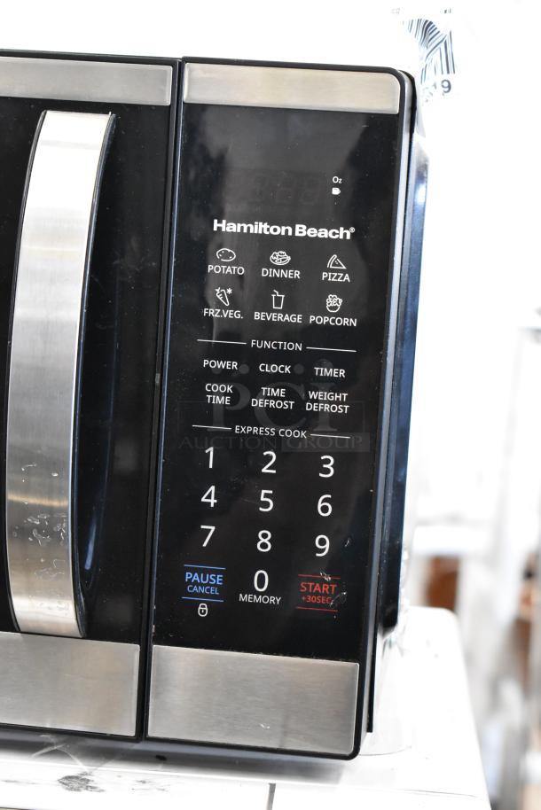 Hamilton Beach HB4302797514-01 countertop microwave oven, featuring touchpad with preset functions. 120 Volts, 1 Phase.