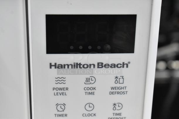 Hamilton Beach HB8436193153-02 countertop microwave, 120V, digital display, labeled controls for power, cook time, and defrost.
