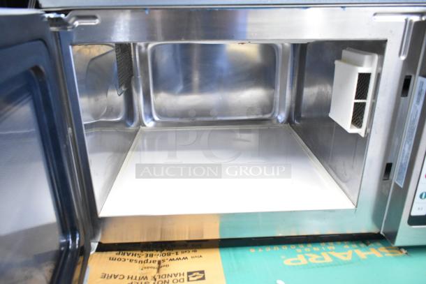 Amana RCS10TS stainless steel commercial countertop microwave, open door view, clean interior, 120 volts, 1 phase.