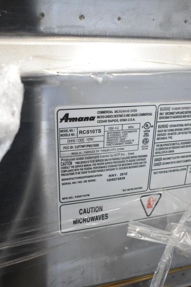 Amana RCS10TS stainless steel commercial microwave, 120V, model label, caution warnings, manufactured May 2012.