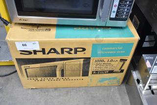 Sharp R-21LVF countertop microwave in original box. 1000 watts, 1.0 cu. ft. Stainless steel, 120 volts, 1 phase.