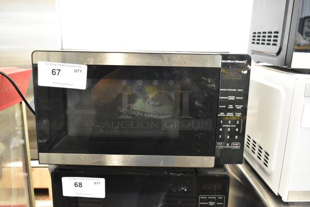 Hamilton Beach HB8436127995-01 stainless steel commercial countertop microwave oven, 120 volts, control keypad, auction tags visible.