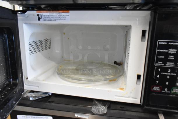 Hamilton Beach MS8436127995-01 stainless steel commercial microwave oven, 120V, 1 phase, used, interior stains visible.