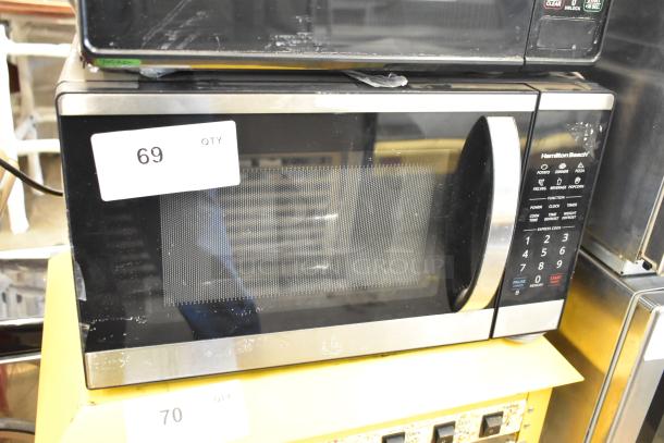 2023 Hamilton Beach HB4302797514-01 stainless steel commercial countertop microwave oven, clean exterior, 120 volts, operational buttons visible.